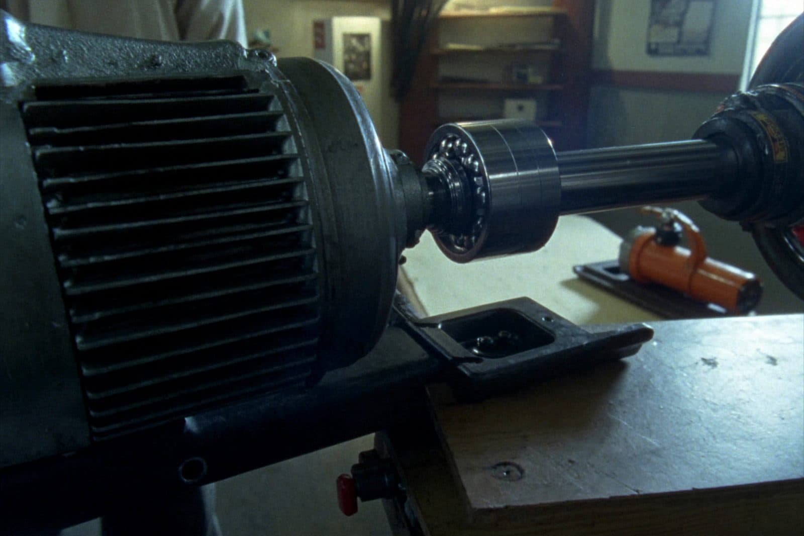 A new bearing being pressed onto a motor shaft